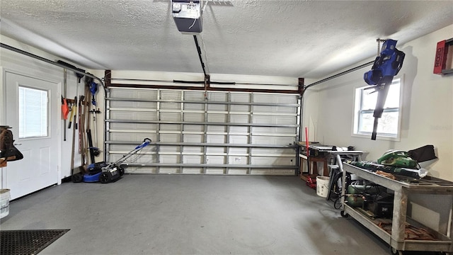 garage featuring a garage door opener