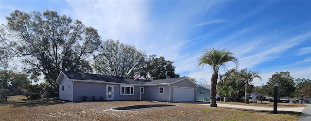 ranch-style home featuring a garage