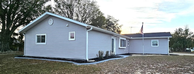 view of property exterior at dusk