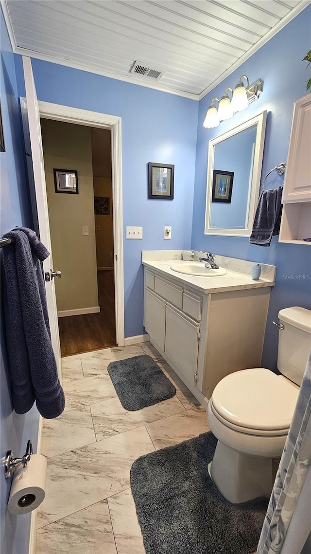 bathroom featuring vanity, toilet, and wooden ceiling