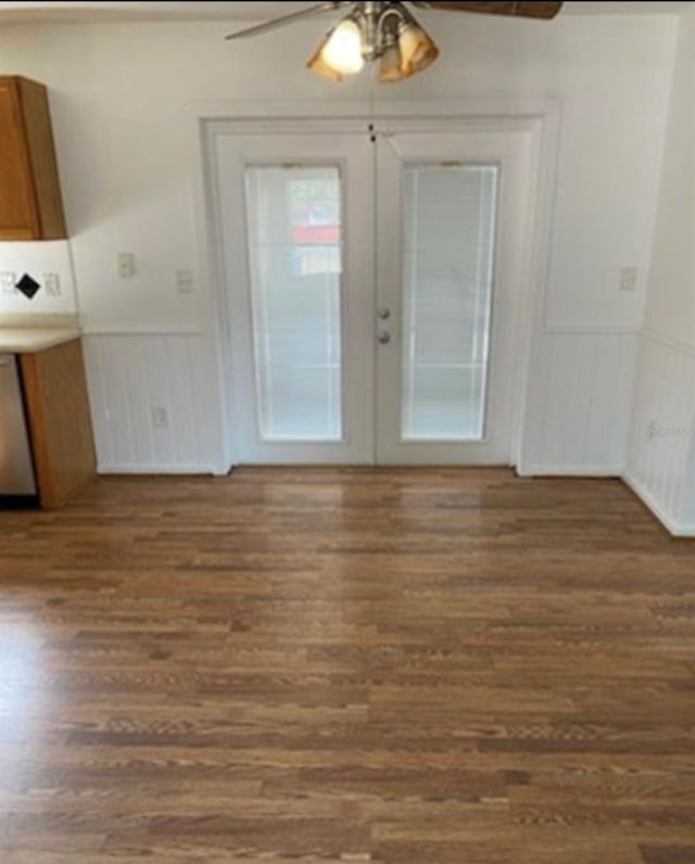 interior space featuring dark hardwood / wood-style floors, ceiling fan, and french doors