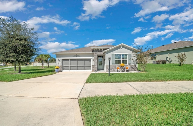 view of front of property featuring a garage and a front yard