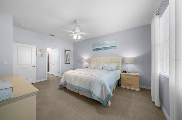 tiled bedroom with ceiling fan