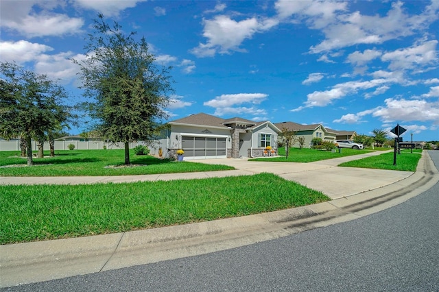 single story home with a garage and a front yard