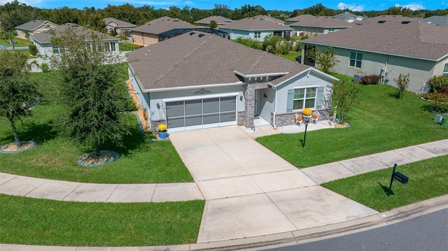 single story home with a garage and a front yard