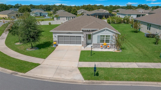 view of front of house featuring a front yard and a garage