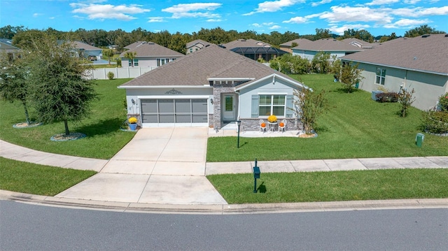 view of front of home with a garage and a front yard