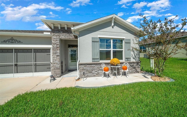 view of front of house with a garage and a front yard