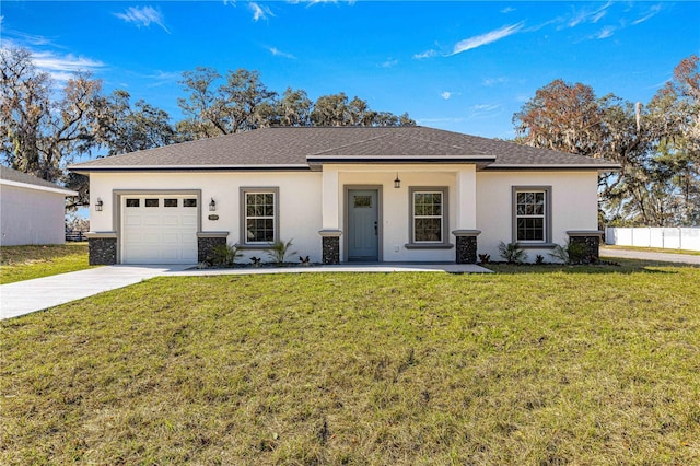 view of front facade with a garage and a front lawn