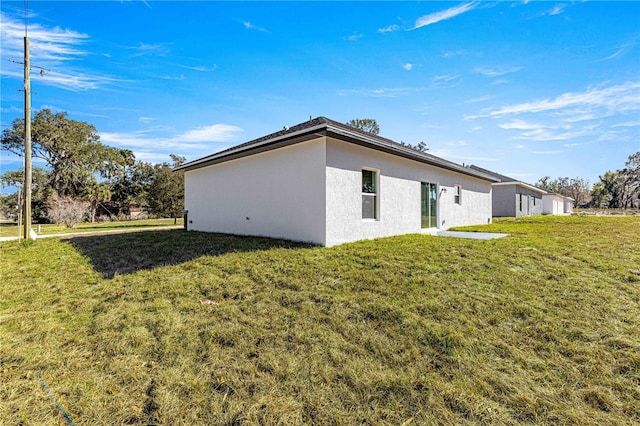 view of property exterior featuring a yard