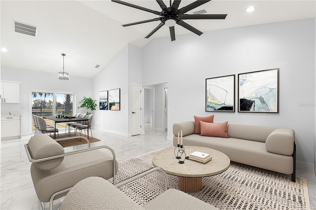 living room featuring ceiling fan and high vaulted ceiling