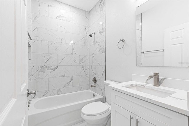 full bathroom featuring vanity, toilet, and tiled shower / bath