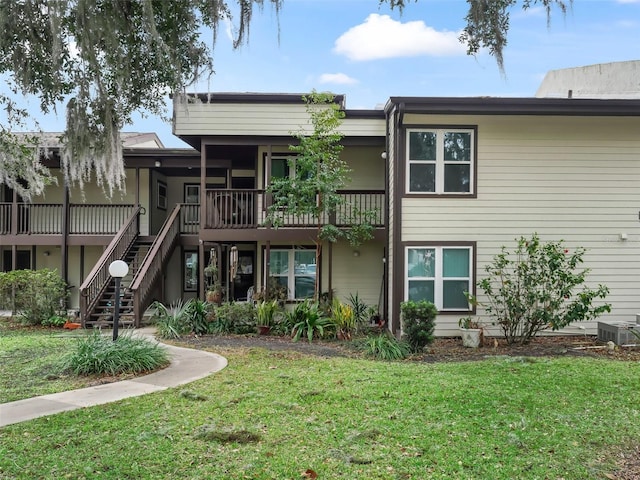 exterior space with a lawn and cooling unit