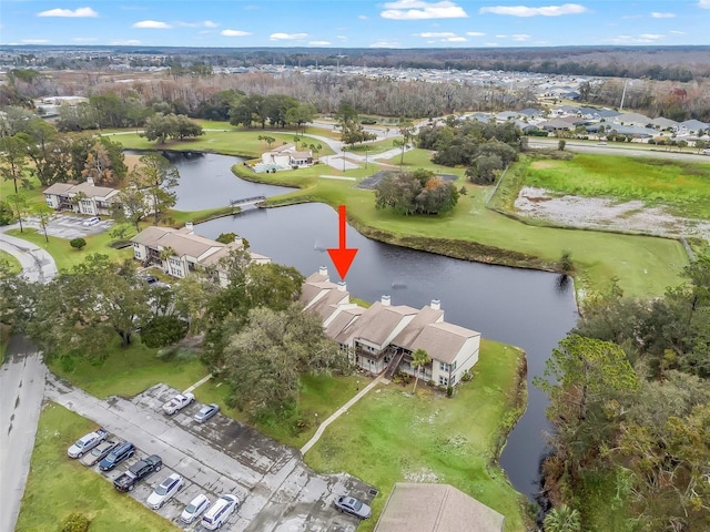 birds eye view of property with a water view