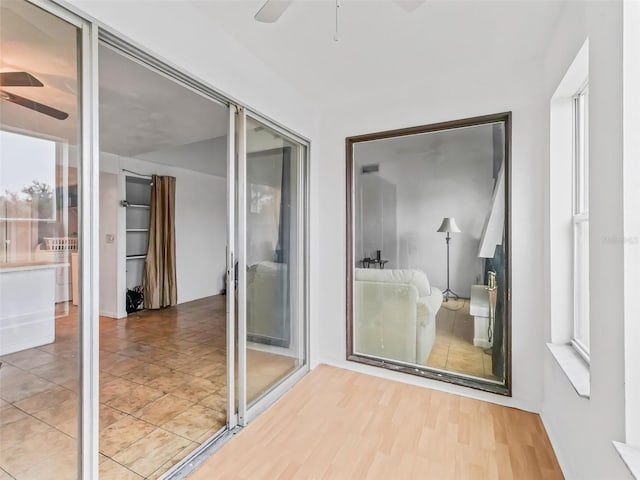 interior space with ceiling fan and light hardwood / wood-style flooring