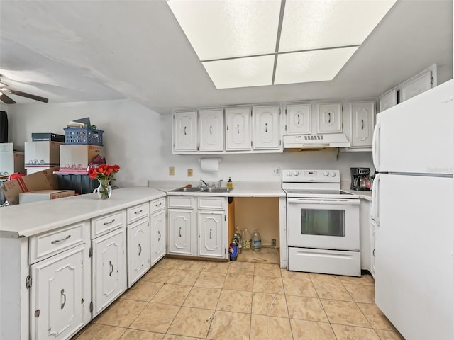 kitchen with white appliances, light tile patterned floors, sink, white cabinets, and kitchen peninsula