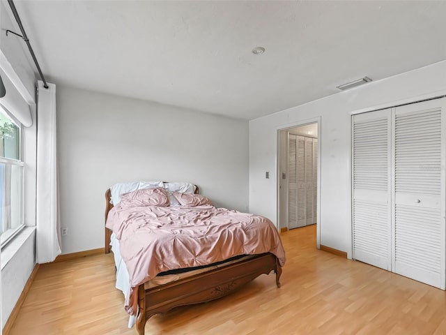 bedroom with light wood-type flooring