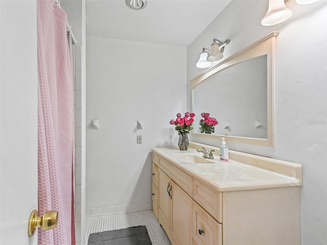 bathroom featuring vanity, walk in shower, and tile patterned flooring