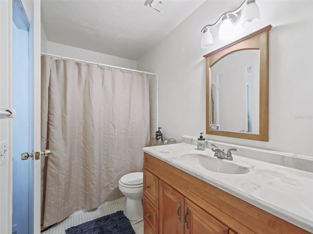 bathroom with tile patterned floors, toilet, and vanity