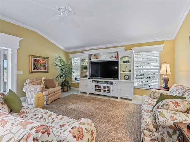 living room with ceiling fan, ornamental molding, and vaulted ceiling