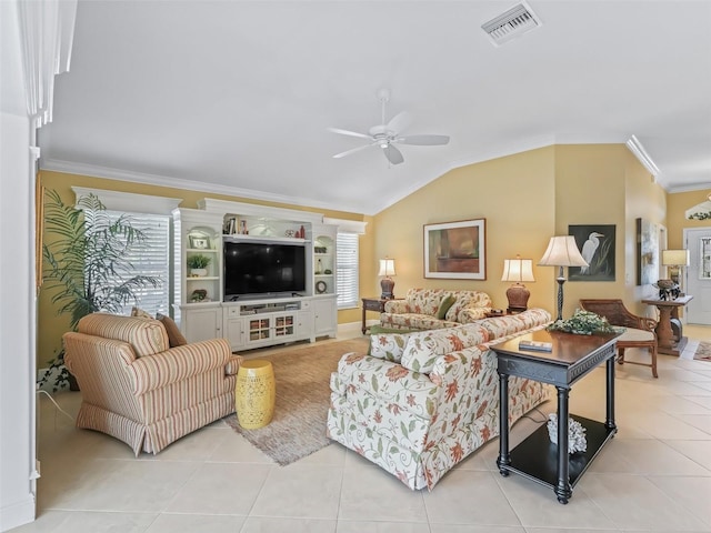 tiled living room featuring lofted ceiling, ceiling fan, ornamental molding, and a healthy amount of sunlight