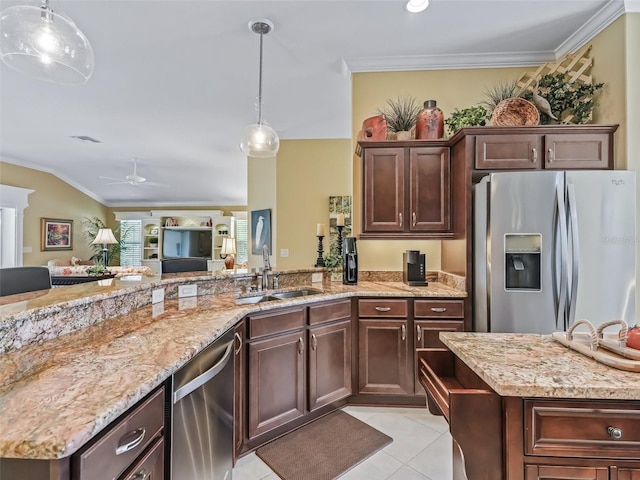 kitchen featuring ornamental molding, stainless steel appliances, sink, and dark brown cabinets