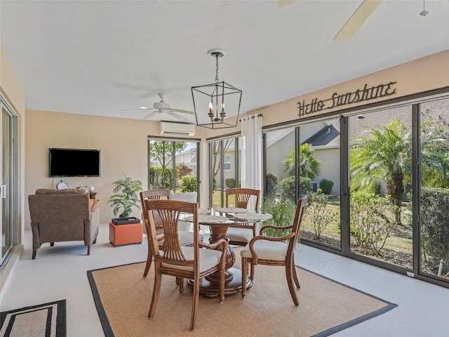 dining area featuring ceiling fan with notable chandelier and an AC wall unit