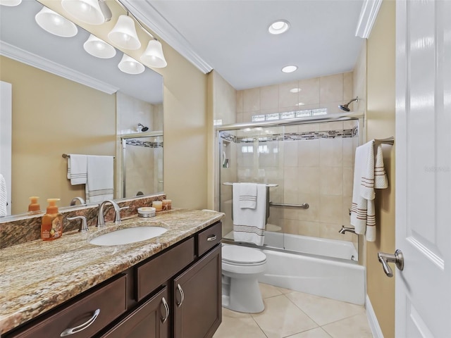 full bathroom featuring crown molding, enclosed tub / shower combo, tile patterned flooring, vanity, and toilet