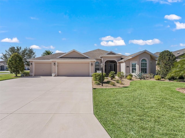 ranch-style house featuring a garage and a front yard