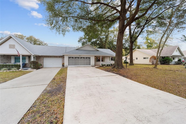 ranch-style home featuring a garage and a front lawn