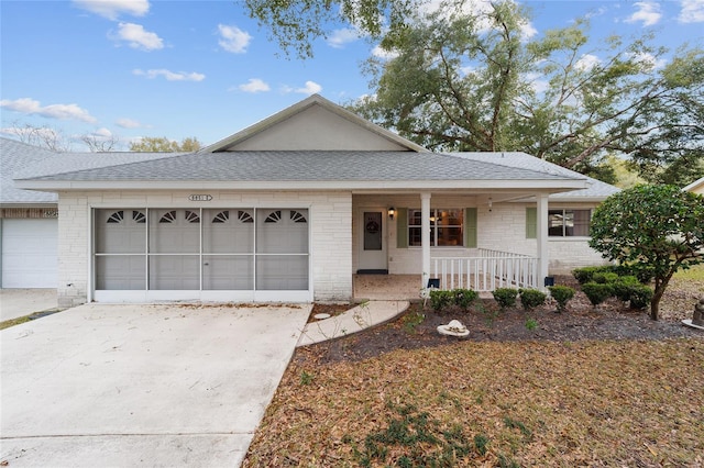 view of front of property with a garage and a porch