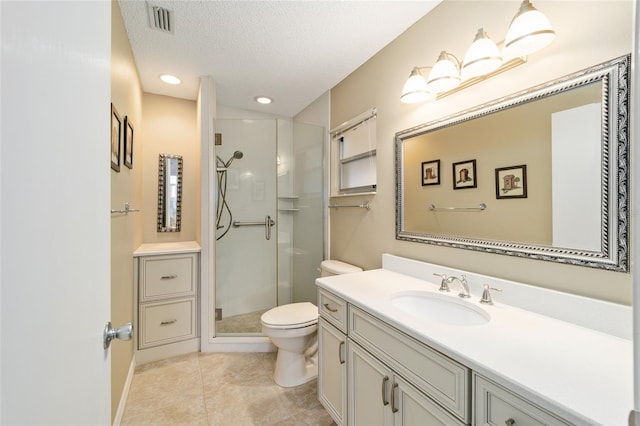 bathroom with a shower with shower door, a textured ceiling, toilet, and vanity