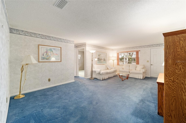 living room featuring carpet and a textured ceiling