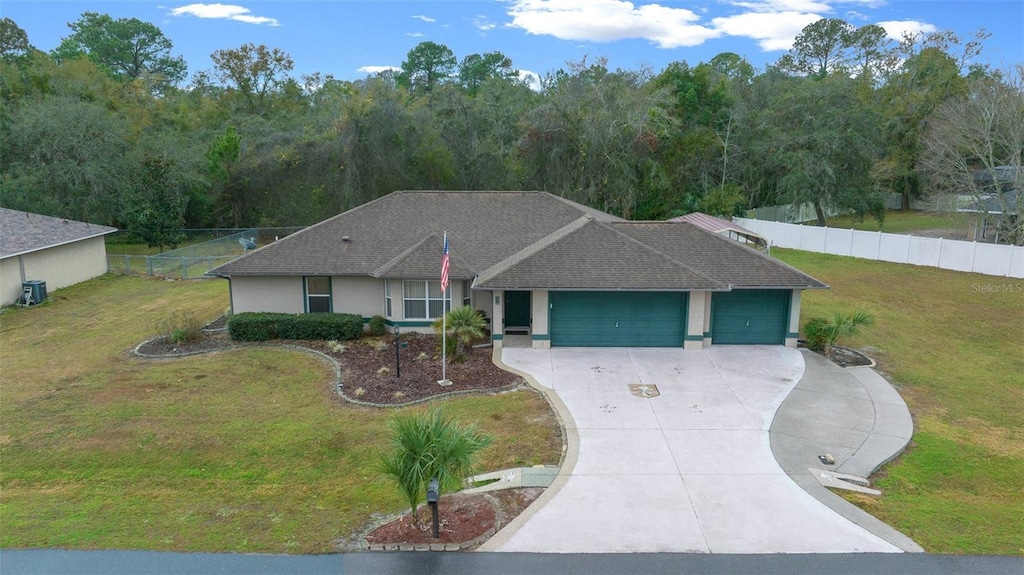 ranch-style house featuring a front yard and a garage