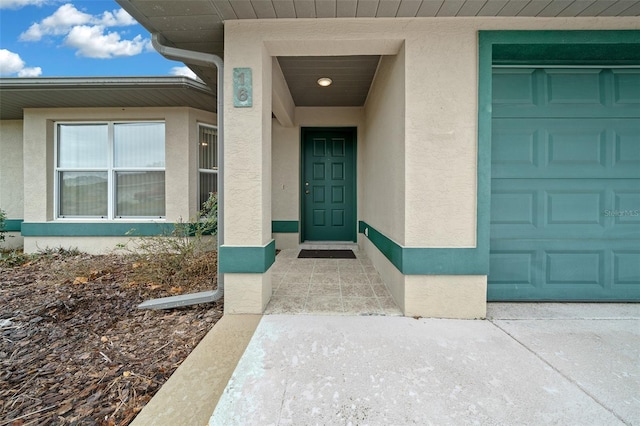 doorway to property with a garage