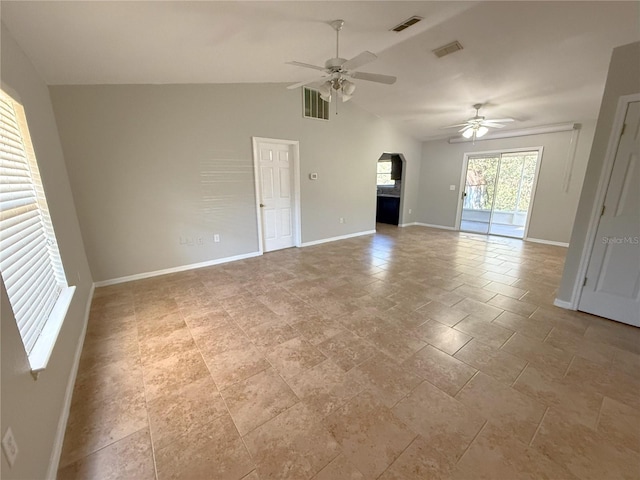 unfurnished living room featuring vaulted ceiling and ceiling fan