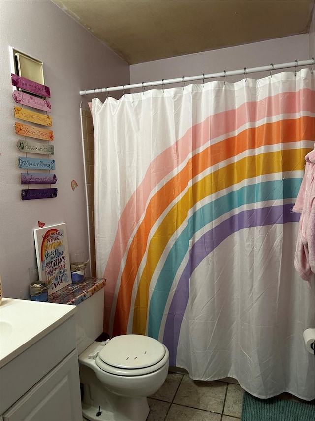 bathroom with a shower with curtain, tile patterned floors, toilet, and vanity