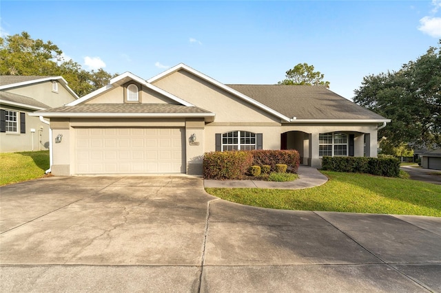 single story home with a garage and a front yard