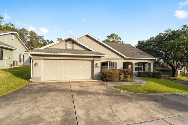 view of front facade with a front yard and a garage