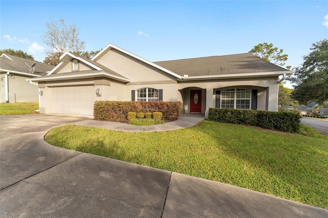 ranch-style house featuring a front yard and a garage