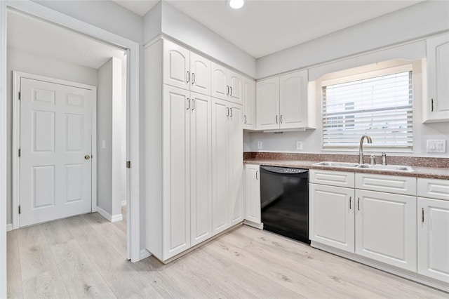 kitchen with sink, white cabinets, black dishwasher, and light wood-type flooring