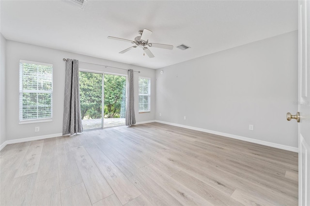 spare room with light hardwood / wood-style floors and ceiling fan