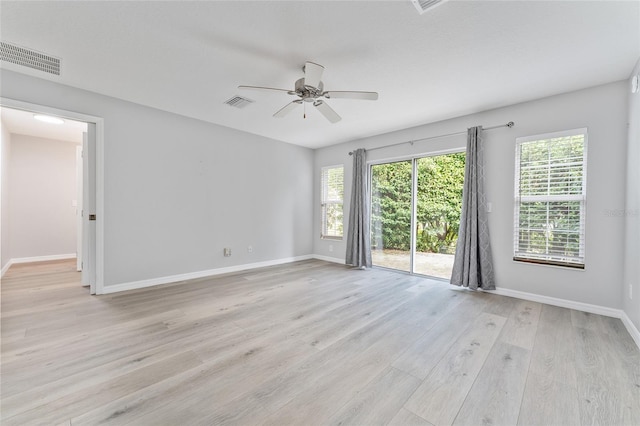 empty room featuring light wood-type flooring and ceiling fan