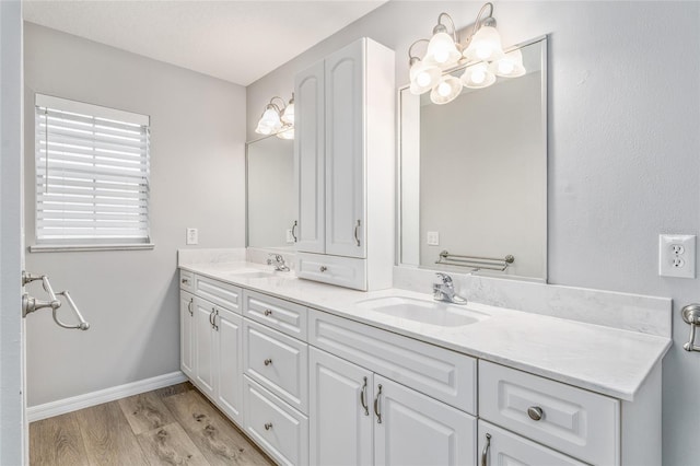 bathroom featuring vanity and hardwood / wood-style flooring