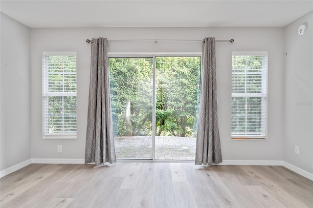 unfurnished room featuring light hardwood / wood-style flooring