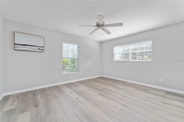 unfurnished room with ceiling fan and light hardwood / wood-style floors