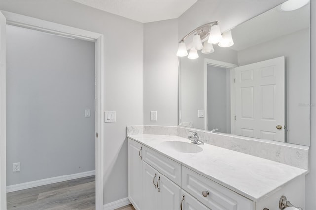 bathroom with hardwood / wood-style flooring and vanity