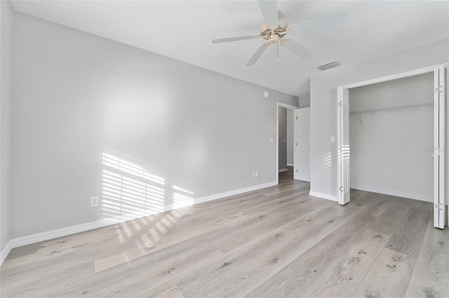 unfurnished bedroom featuring a closet, ceiling fan, and light wood-type flooring