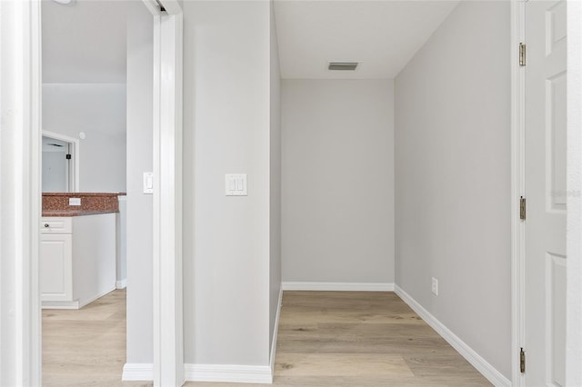 corridor featuring light hardwood / wood-style floors