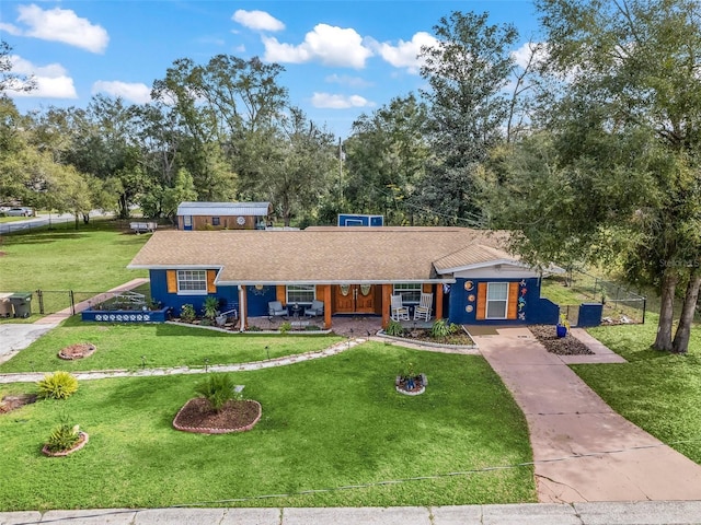 single story home featuring a front yard